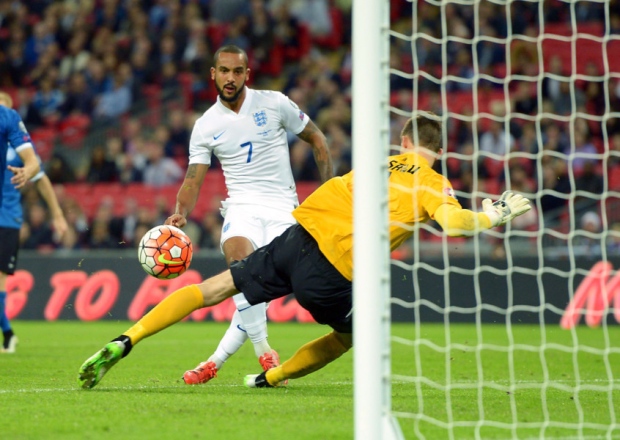 England's Theo Walcott scores his side's first goal