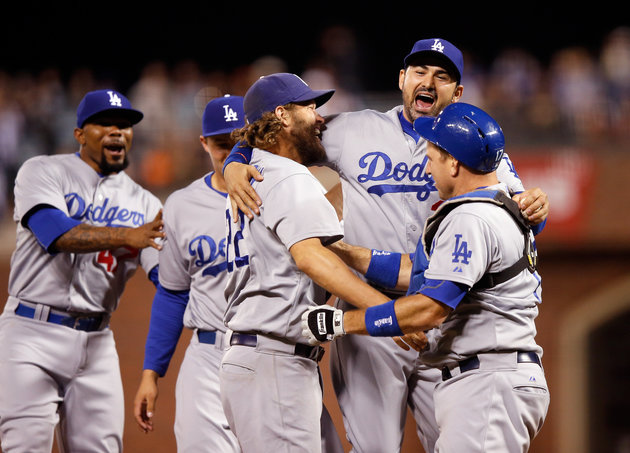 The Dodgers celebrate after clinching the NL West division title against rival San Francisco on Sept. 29 2015