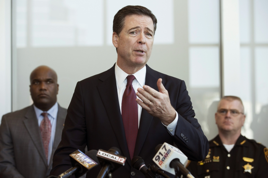 FBI Director James Comey speaks to the media during a news conference at the FBI offices in Cincinnati. Three federal cyberstalking cases that surfaced within a few days of each other in the Cincinnati