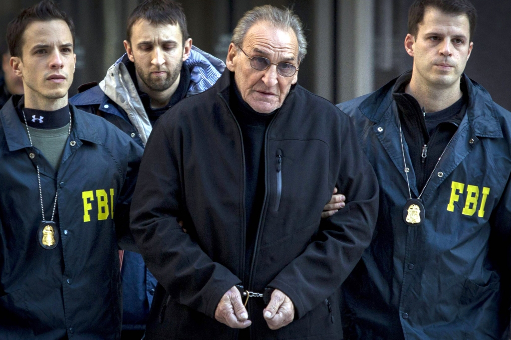 FBI agents lead Vincent Asaro from their Manhattan offices on Jan. 23