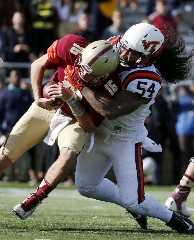 Virginia Tech linebacker Andrew Motuapuaka sacks Boston College quarterback Troy Flutie during a game in Boston on Saturday Oct. 31 2015