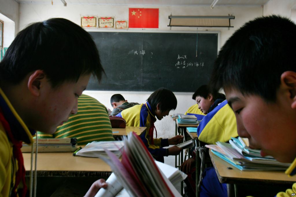 FILE- Children study in small rural primary school in the Chang ling Xia Cou village north of Beijing China