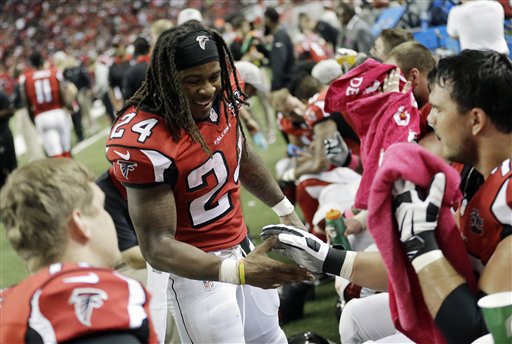 Atlanta Falcons running back Devonta Freeman celebrates his touchdown against the Houston Texans during the second half of an NFL football game Sunday Oct. 4 2015 in Atlanta