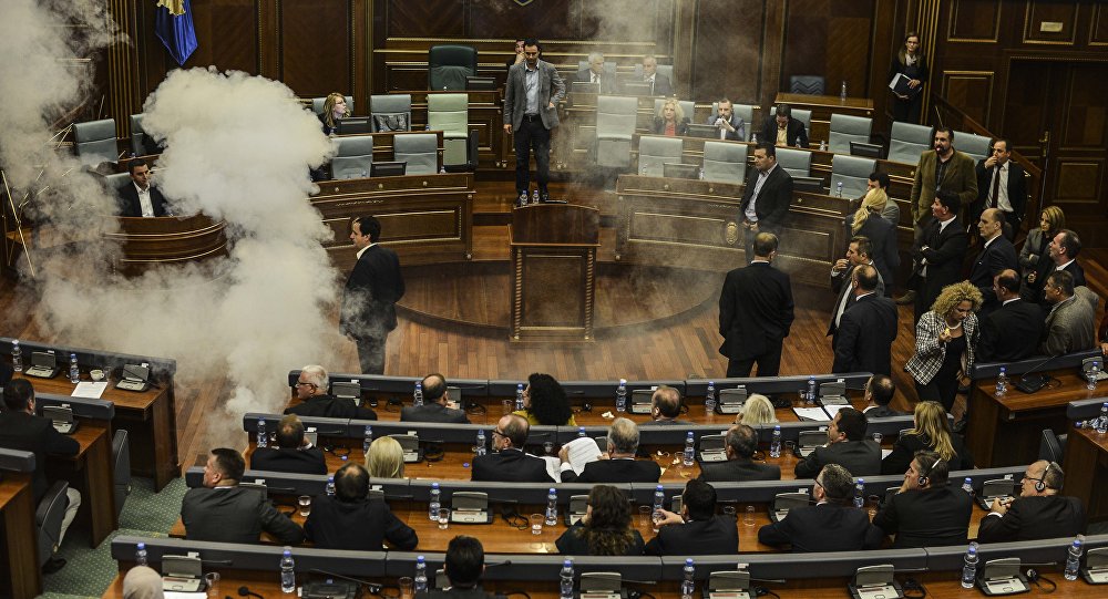 The chamber of the Kosovo parliament was reportedly filled with smoke after an opposition lawmaker threw an unidentified device inside the building on Thursday