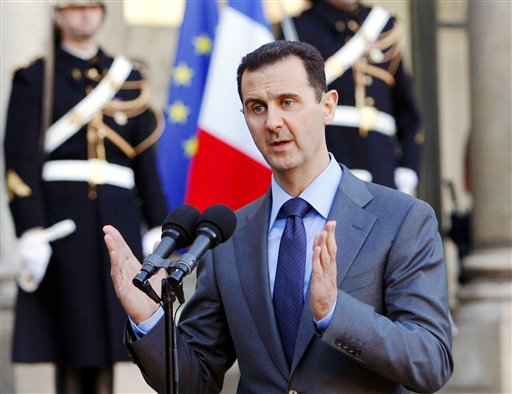 Syria President Bashar al Assad addresses reporters following his meeting with French President Nicolas Sarkozy at the Elysee Palace in Paris France. Paris prosecutors have opened a preliminary investigati