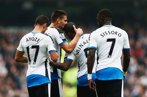 Aleksandar Mitrovic celebrates with teammates after scoring the opening goal