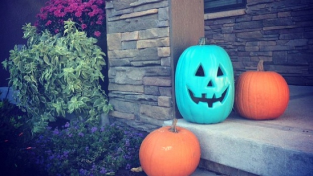 By painting a pumpkin teal and you'll be letting trick-or-treaters with food allergies know that you're also handing out non-food items this Halloween