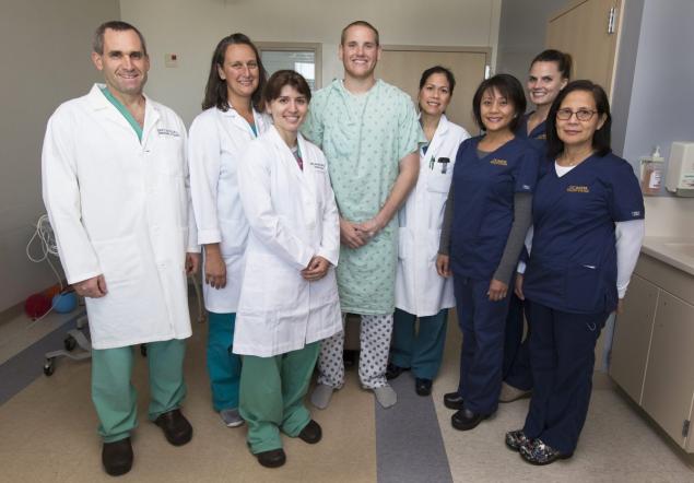 Airman Spencer Stone is seen with members of his care team at UC Davis Medical Center in Sacramento Calif. shortly before his release Thursday