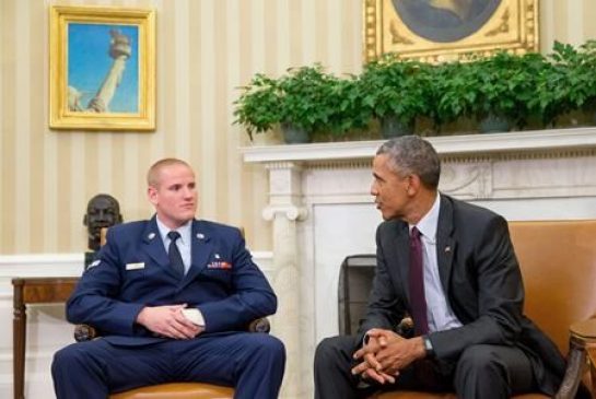 President Barack Obama speaks to Air Force Airman 1st Class Spencer Stone in the Oval Office of the White House in Washington