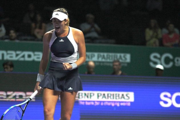 Garbine Muguruza reacts after winning a point against Lucie Safarova in the round robin match of the White Group of the WTA Finals in Singapore on Monday 26 Oct