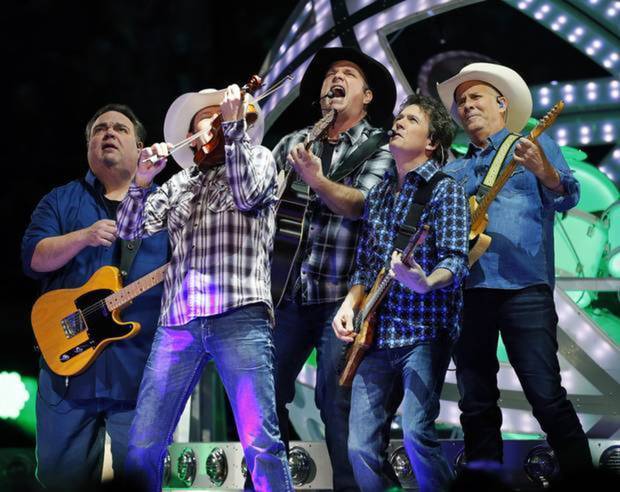 Garth Brooks and his bandmates perform at the BOK Center in Tulsa Okla. Friday Jan. 9 2015