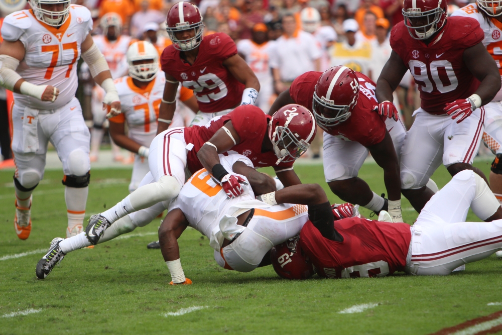 Geno Matias Smith and Reggie Ragland make a tackle against Tennessee. CW | Layton Dudley