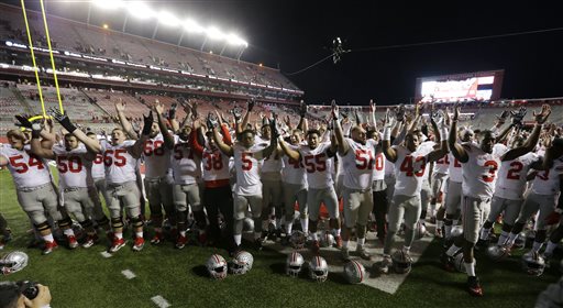 Ohio State players sing the alma mater on the field after an NCAA college football game against Rutgers Saturday Oct. 24 2015 in Piscataway N.J. Ohio State won 49-7