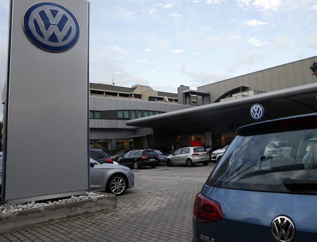 Cars are parked at a Volkswagen dealer in Milan Italy Thursday Oct. 15 2015. Italian authorities have searched the headquarters of Volkswagen Italia as part of a local investigation into the emissions testing scandal at the German automaker. The finan