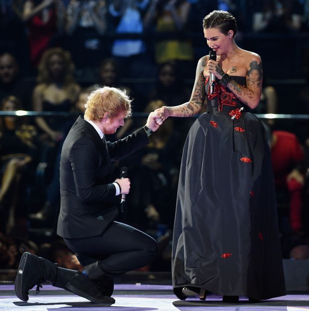 Ed Sheeran kneels to his co-host actress Ruby Rose