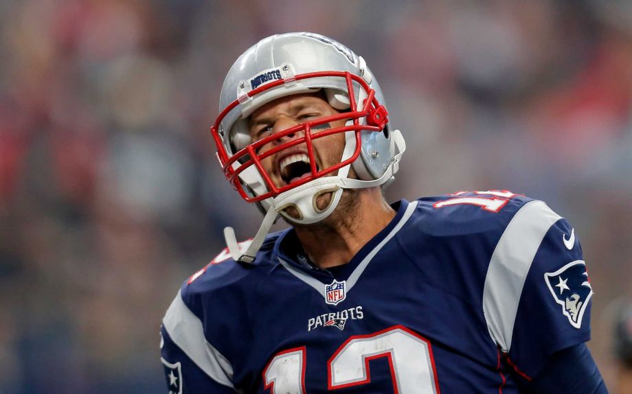 New England Patriots Tom Brady celebrates after scoring on a 1-yard run against the Dallas Cowboys during the first half of an NFL football game Sunday Oct. 11 2015 in Arlington Texas. ORG XMIT TXEG118