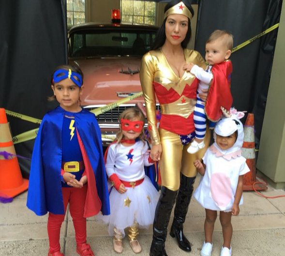 Kourtney Kardashians & her kids wear superhero costumes for Halloween. News Source