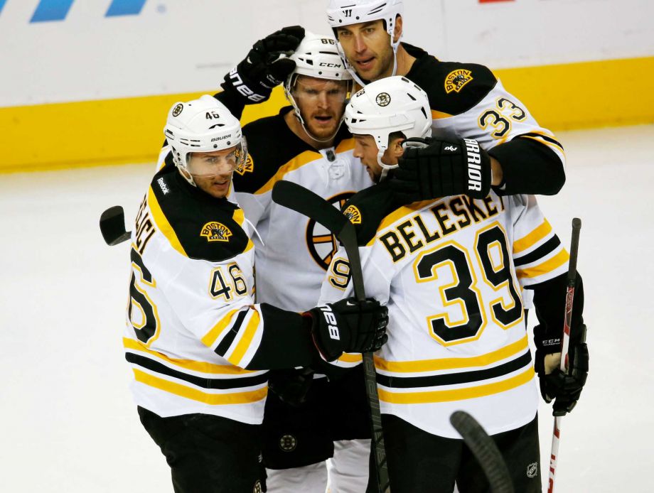 Boston Bruins center David Krejci left of the Czech Republic celebrates scoring goal with left wing David Pastrnak center of the Czech Republic defenseman Zdeno Chara back right of Slovakia and left wing Matt Beleskey front right against the Co