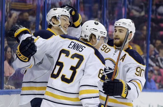 Sam Reinhart left celebrates his goal against the Tampa Bay Lightning with left wing Tyler Ennis center and center Ryan O'Reilly left during the first period of an NHL hockey game Saturday Oct. 17 2015 in Tampa Fla