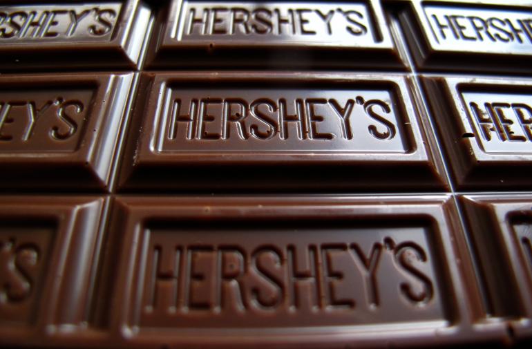 Chocolate maker Hershey Co reported a lower-than-expected quarterly revenue as demand for bakery and meat snacks hurt chocolate sales