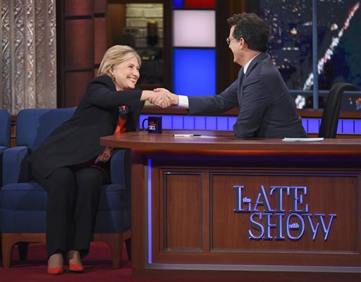 In this image released by CBS Democratic Presidential candidate Hillary Clinton left shakes hands with host Stephen Colbert during a taping of'The Late Show with Stephen Colbert' Tuesday Oct. 27 2015 in New York