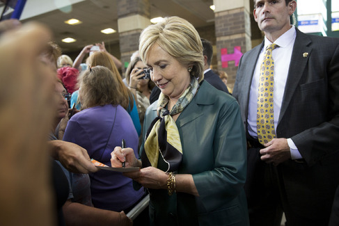 Hillary Clinton signs an autograph after speaking at a campaign stop in Davenport Iowa on Tuesday Oct. 6 2015