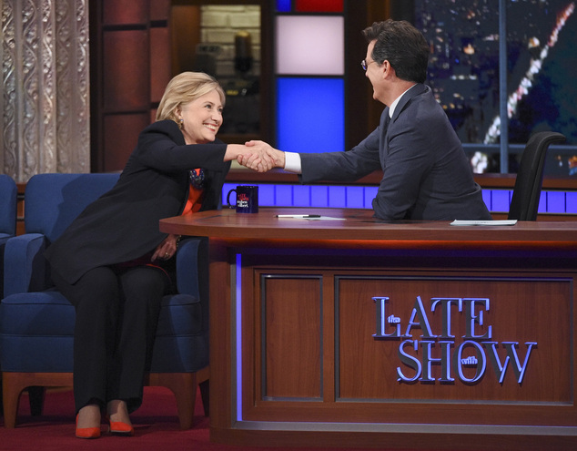 In this image released by CBS Democratic Presidential candidate Hillary Clinton left shakes hands with host Stephen Colbert during a taping of'The Late S