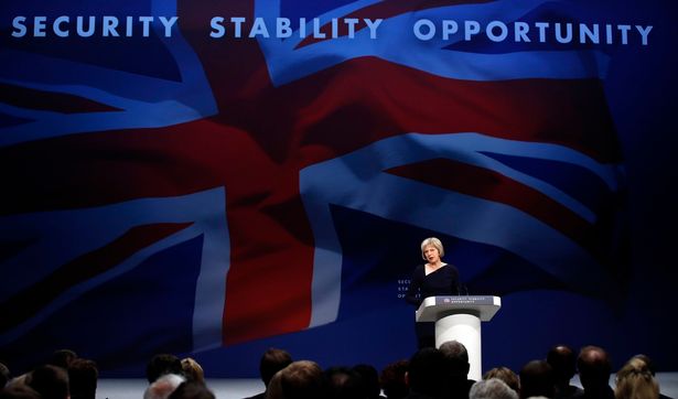 Home Secretary Theresa May delivers her speech to the Conservative Party conference