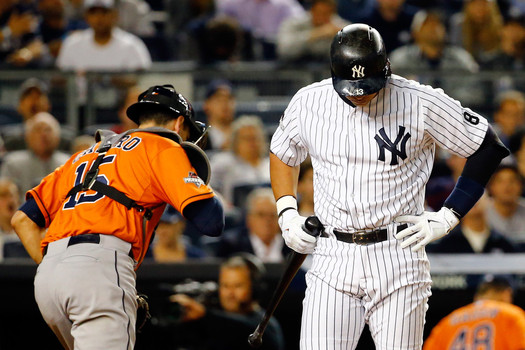 Alex Rodriguez #13 of the New York Yankees looks on after being stuck out against Dallas Keuchel #60 of the Houston Astros during the first inning in the American League Wild Card Game at Yankee Stadium