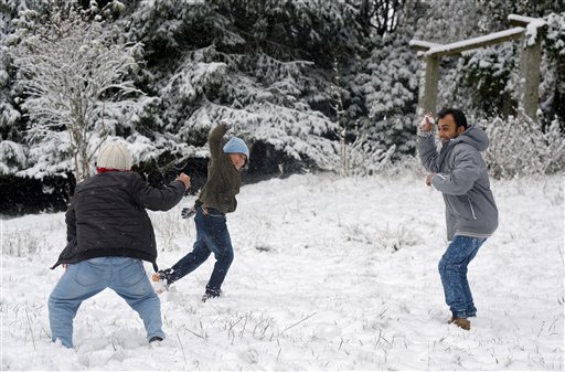 Syrian refugees play in the snow at the refugee home in the former Rehberg Hospital in the Harz mountains in St. Andreasberg Germany Oct. 14 2015