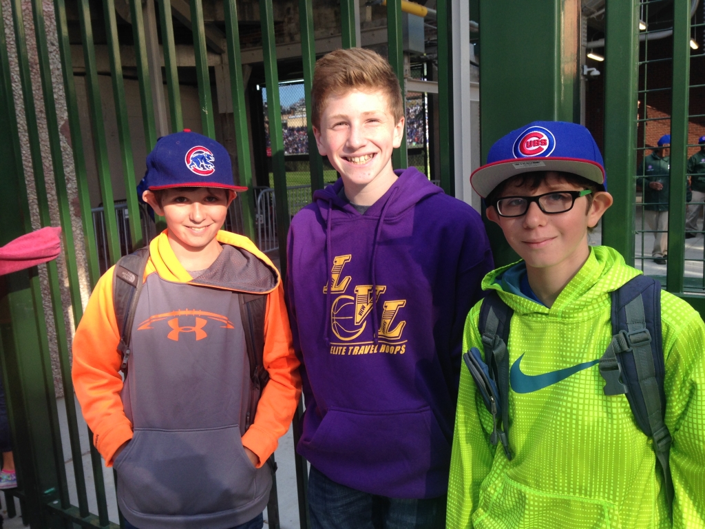 Identical twins Carter and Ethan Loevy flank pal Henry Landgraff outside Wrigley Field on Tuesday. | Mitch Dudek  Sun-Times