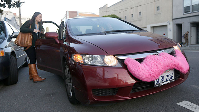 Lyft passenger Christina Shatzen gets into a car driven by Nancy Tcheou in San Francisco