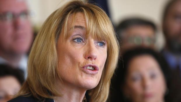 Democratic Gov. Maggie Hassan speaks at a news conference at the Statehouse in Concord