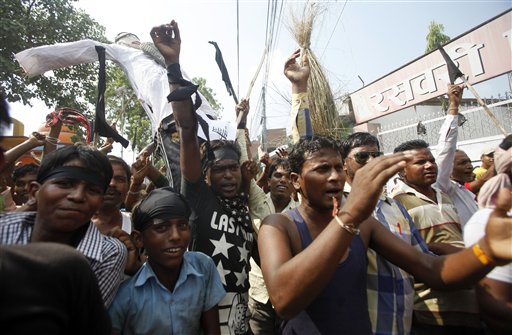 Protestors belonging to ethnic and religious groups dissatisfied with Nepal's new constitution raise slogans during a protest in Janakpur Nepal Tuesday Sept. 29 2015. Nepal started imposing restrictions on the movement of vehicles on Sunday