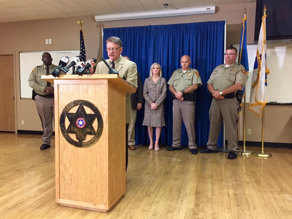 Undersheriff Rick Weigel accompanied by administrative staff of the Tulsa County Sheriff's Office gives a statement at a news conference