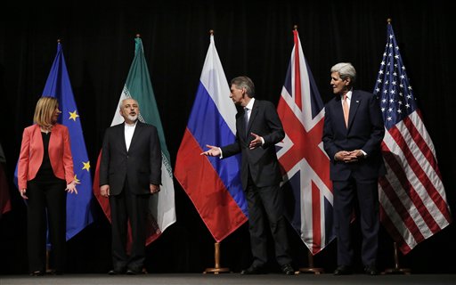 British Foreign Secretary Philip Hammond second right U.S. Secretary of State John Kerry right and European Union High Representative for Foreign Affairs and Security Policy Federica Mogherini left talk to Iranian Foreign