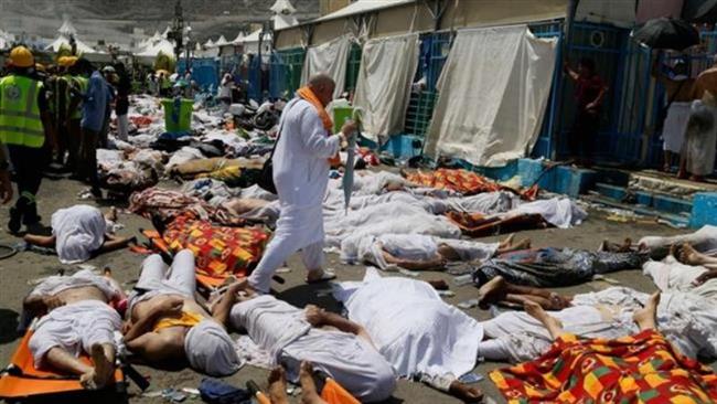 A pilgrim walks among dead bodies after a crush in Mina Saudi Arabia during the Hajj pilgrimage rituals