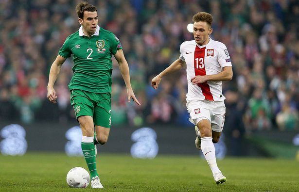 Ireland's Seamus Coleman and Maciej Rybus of Poland