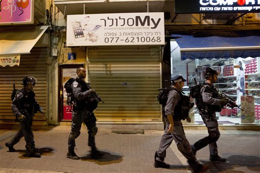 Israeli police officers patrol near the site of a stabbing attack in Afula northern Israel Thursday Oct. 8 2015. After attacks in Jerusalem and the West Bank left two Israelis seriously wounded Thursday the violence spread deeper into Israel when pol