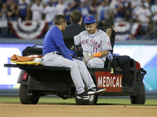 New York Mets shortstop Ruben Tejada is taken off the field after being hurt in a double play against the Los Angeles Dodgers during the seventh inning in Game 2 of baseball's National League Division Series Saturday Oct. 10 2015 in Los Angeles