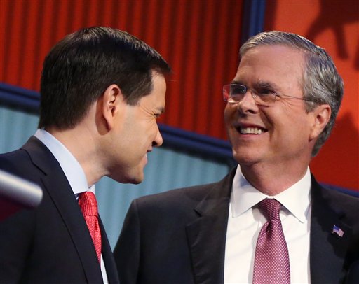 Republican presidential candidates Marco Rubio left and Jeb Bush talk during a break during the first Republican presidential debate at the Quicken Loans Arena in Cleveland. There are more than a dozen major candi