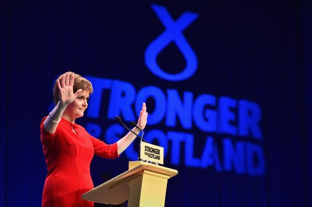 Jeff J Mitchell

First Minister Nicola Sturgeon acknowledges applause before her keynote speech at the 81st annual SNP conference