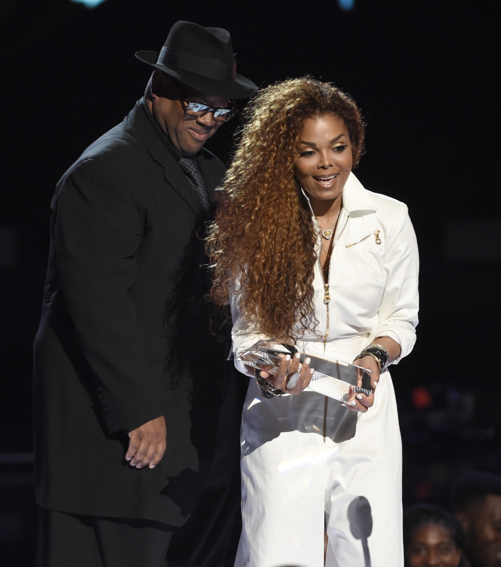 Jimmy Jam left presents the ultimate icon music dance visual award to Janet Jackson at the BET Awards in June