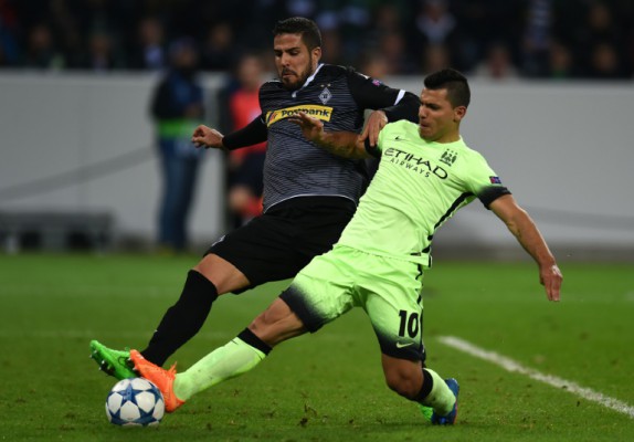 AFP  Patrik StollarzMoenchengladbach's Alvaro Dominguez vies with Manchester City's Sergio Aguero during the UEFA Champions League first-leg Group D football match in Monchengladbach western Germany
