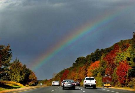 A rainbow was seen over Route 495 in Mansfield as rain showers moved through the area Friday morning