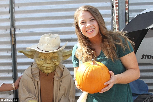 Jokster The 17-year-old posed next to a prop Yoda holding up the pumpkin as she had her