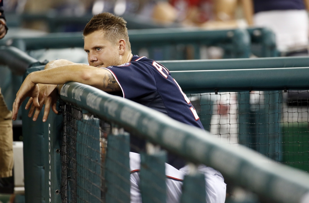 Washington Nationals relief pitcher Jonathan Papelbon leans over the rail of the dugout and watches the New York Mets celebrate after a baseball game at Nationals Park Wednesday Sept. 9 2015 in Washington. The Mets won 5-3