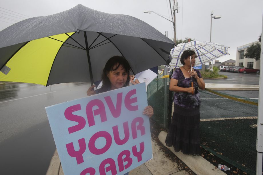 Luz Lozano gathers with other abortion protesters in front of Planned Parenthood on Oct. 22 2015