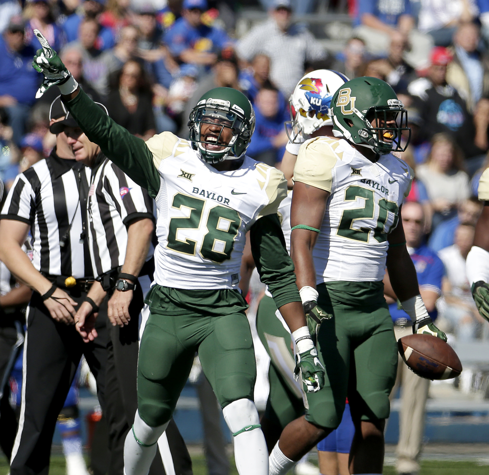 Stewart and linebacker Aiavion Edwards celebrate after Edwards recovered a Kansas fumble during the first half Saturday in Lawrence Kan. Baylor won 66-7. The Bears are No. 2 in the AP poll their highest-ever rankin