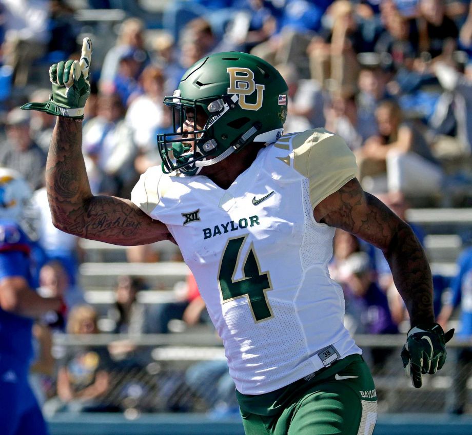 Baylor cornerback Xavien Howard celebrates after recovering a Kansas fumble and running the ball in for a touchdown during the first half of an NCAA college football game Saturday Oct. 10 2015 in Lawrence Kan